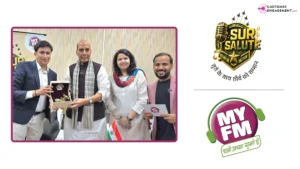 MY FM RJ holding the Tiranga during Sur Salute city event